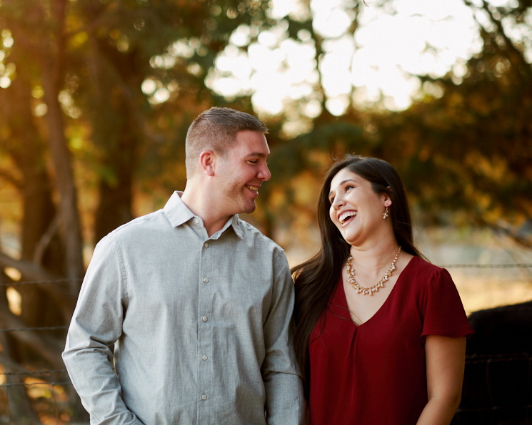 Shared laughter and lovely light during Natalie and Jesse's engagement session at our outdoor photography studio of Austin wedding photographers Mercedes Morgan Photography