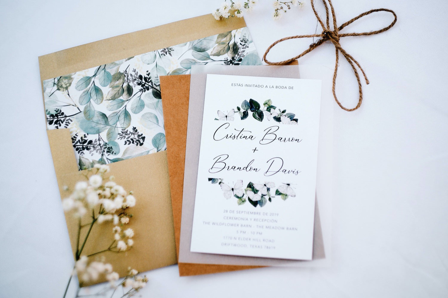 Cristina and Brandon's invitation suite. Photographed by Mercedes Morgan Photography for their Wildflower Barn wedding.